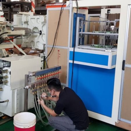 Plastic Injection Molding Peripheral Equipment - Top Unite integrates the professional IML machine and mold into our plastic injection molding machine.